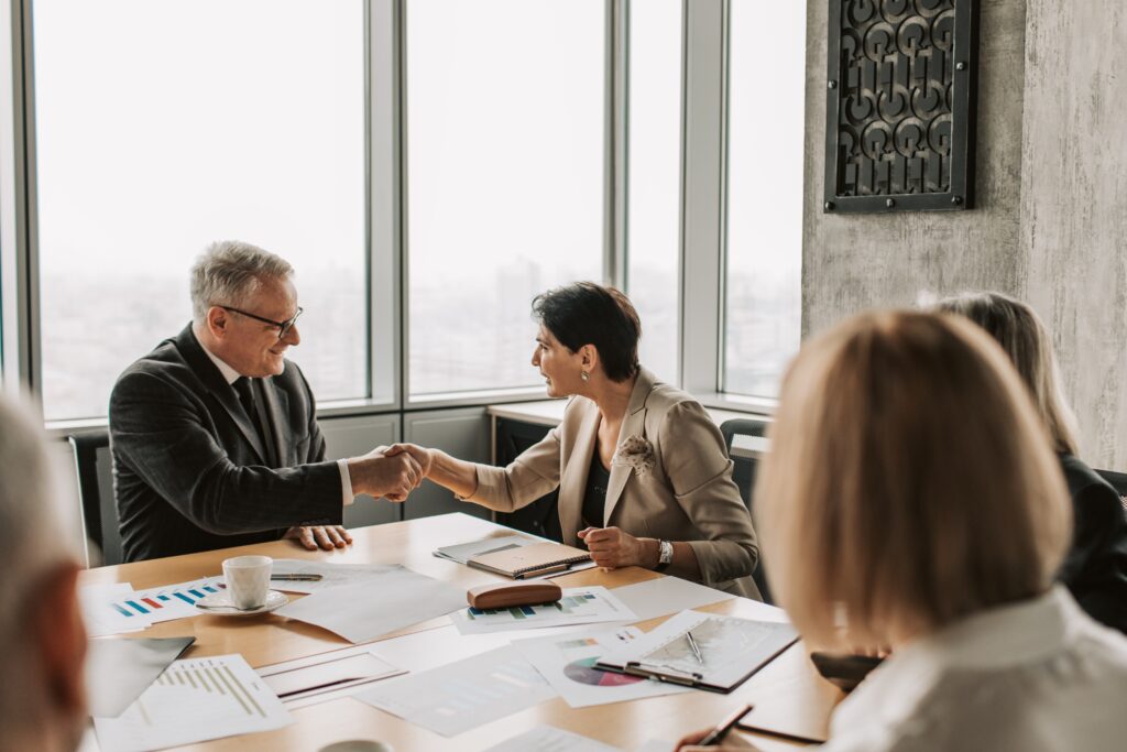 two people shaking hands at an ria valuation