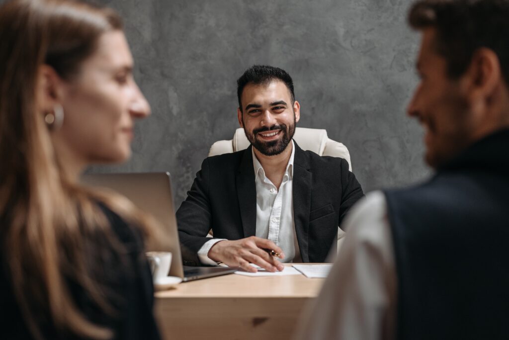 man smiling while preparing for meeting